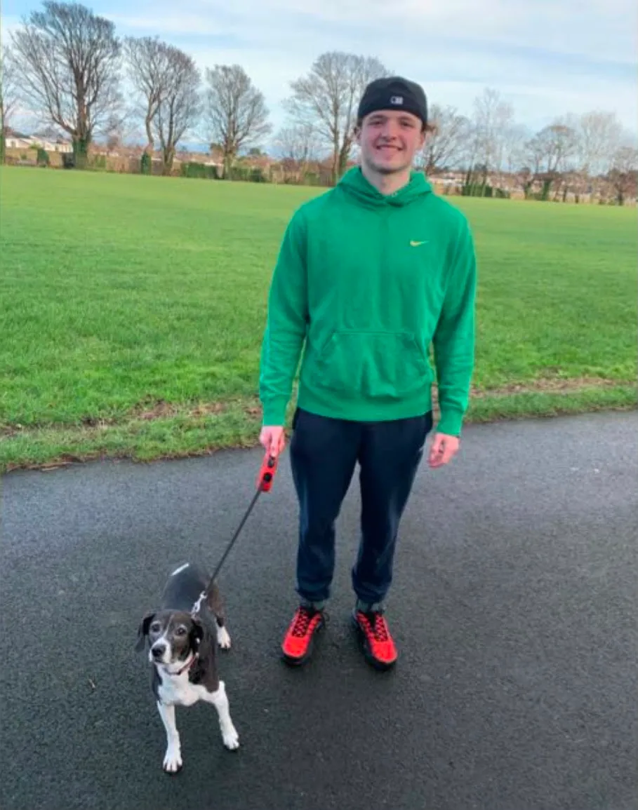 Paul walking a dog in the park