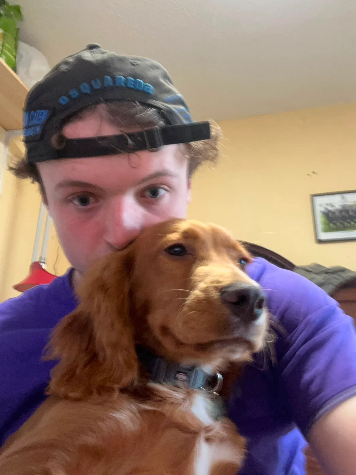 Paul with a dog on his shoulder